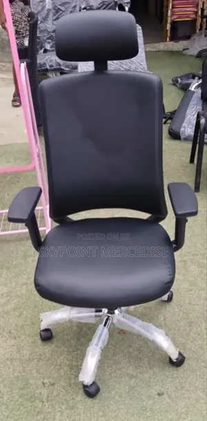 An Executive Office Swivel Chair With Headrest