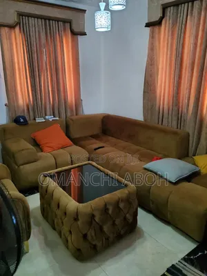 Neatly Used L-Shaped Sofa With Ottoman Glass Topped Center Table