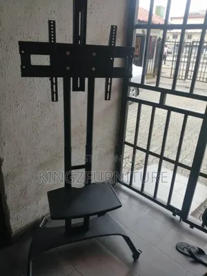 A Black Rolling Mobile Tv Cart, 32 to 75 Inches