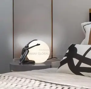 Italian Abstract Ball Holding Character Table Lamp