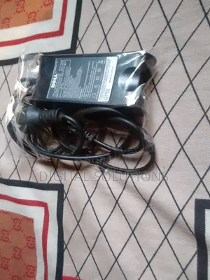 Dell Original Follow-Come Laptop Charger.
