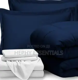 Blue Duvet and White Bedsheets With Pillowcase