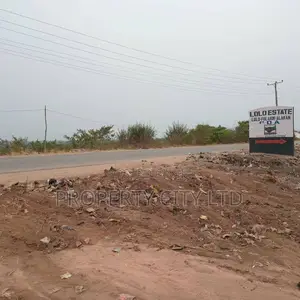 A Fenced and Gated Full Plot Land