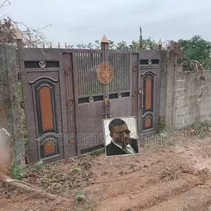 A Fenced and Gated Full Plot Land