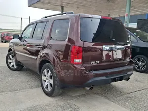 Honda Pilot Touring w/RES/Navi 4WD (3.5L 6cyl 5A) 2013 Burgundy