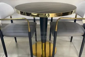 Black Table With Gold Plated Stand and 2 Brown Chairs for Sale