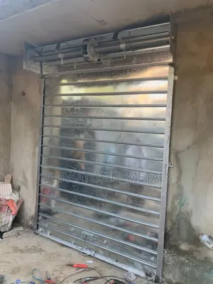 “Galvanized Manual Roller Shutter Door – Strong Shop Security”