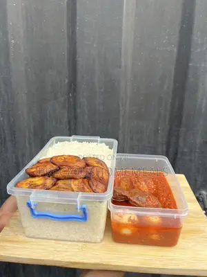 Delicious Bowl of White Rice, Fried Plantains and Meat, Eggs Stew