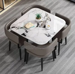Marble-Finish Dining Table Set, Likely Featuring Four Chairs