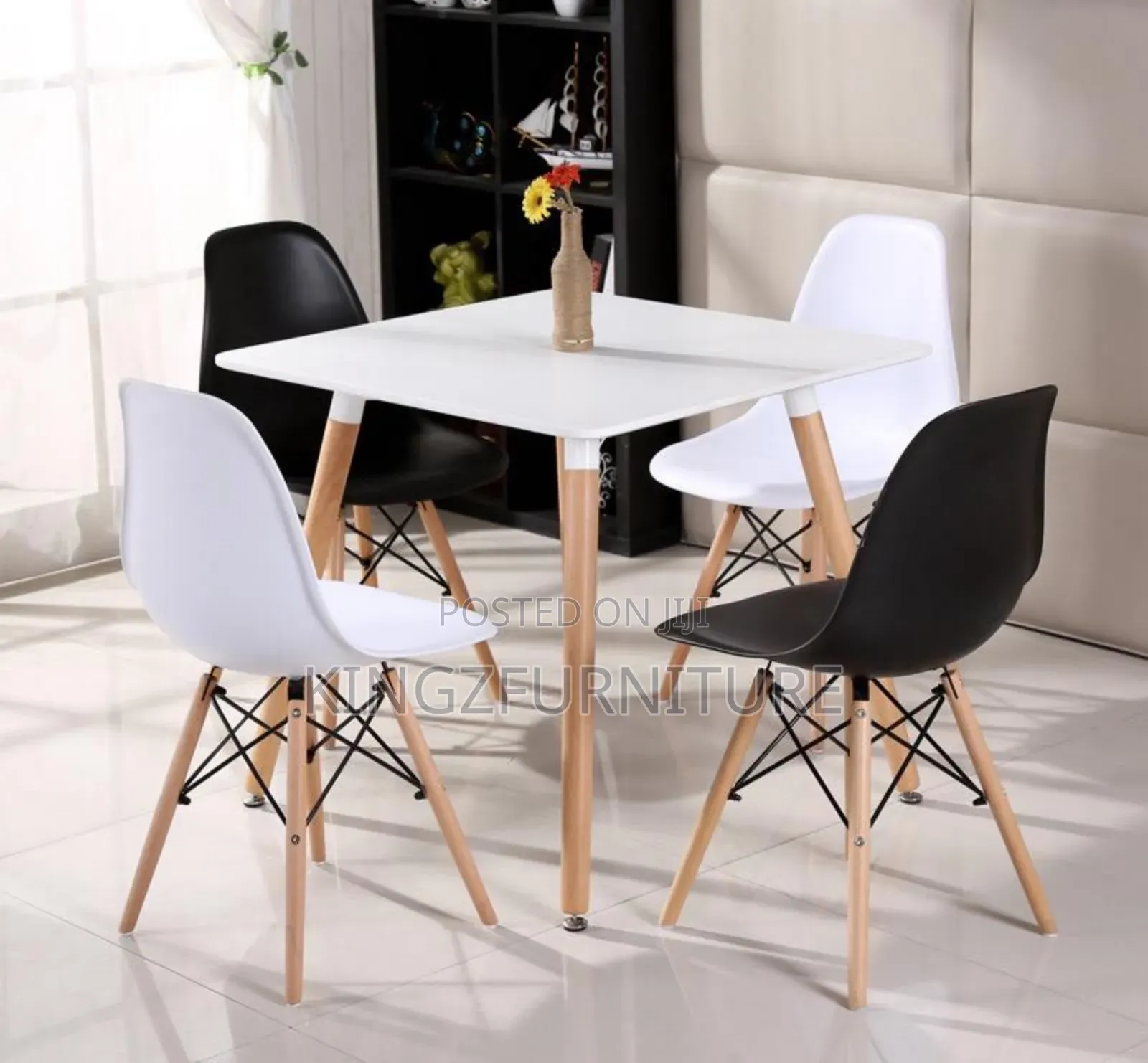 Dining Table Set With White and Black Modern Chairs and a White Table