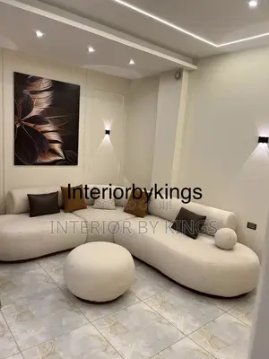Custom Made Minimalist Sofa With a Center Ottoman Can Come in Colors