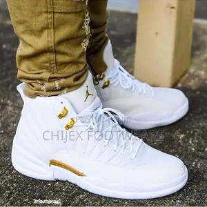 Jordan X Ovo Air Jordan 12 Retro "White/Metallic Gold" Sneakers.
