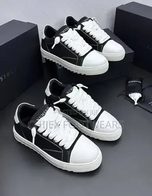 Numeris Atelier Sneakers Featuring a Black and White Design