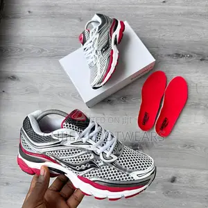 Saucony Progrid Omni 9 Sneakers in a White, Silver, and Red Colorway