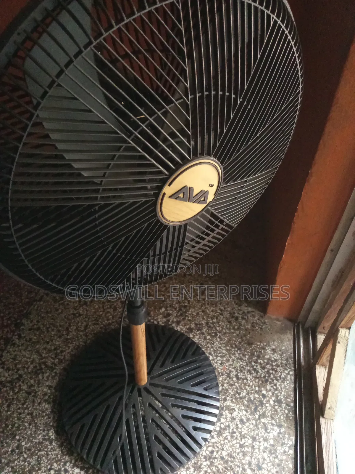 An Ava Advanced Ventilation 18-inch 5-blade Adjustable Standing Fan.