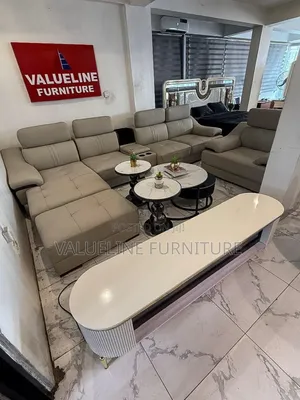 Cream L Shaped Sofa With Center Table and Side Stool