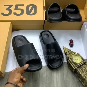 Adidas Yeezy Slide Sandals.