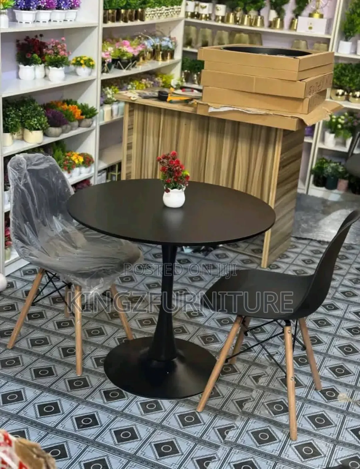 Dining Set Features a Tulip-Style Table Base and Two Eames Chairs.