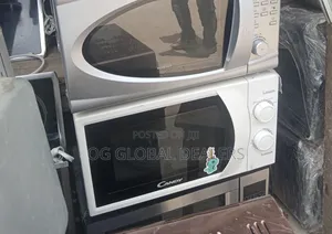 White Countertop Microwave, the Candy CMW 2070 M Model.