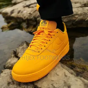 Nike Air Force 1 '07 Pro-Tech Sneakers in a Vibrant Gold Colorway.