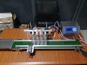 Automatic 4 Nozzle Digital Liquid Filling Machine With Conveyor.
