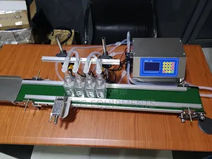 Automatic 4 Nozzle Digital Liquid Filling Machine With Conveyor.