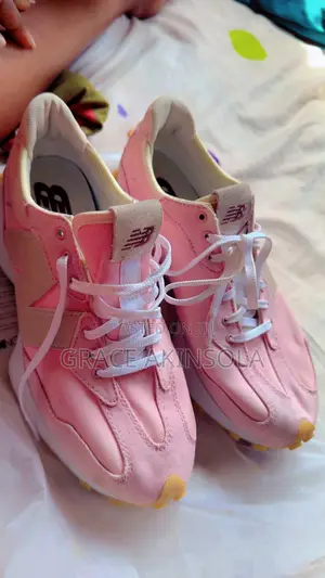 A Pink and White New Balance Designer Unisex Trainers
