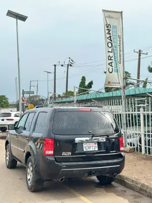 Honda Pilot Touring w/RES/Navi FWD (3.5L 6cyl 5A) 2010 Black
