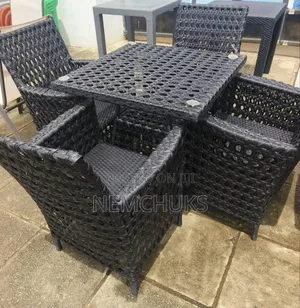 Rattan Outdoor Table and Chairs Set Designed for Patio or Garden Use.