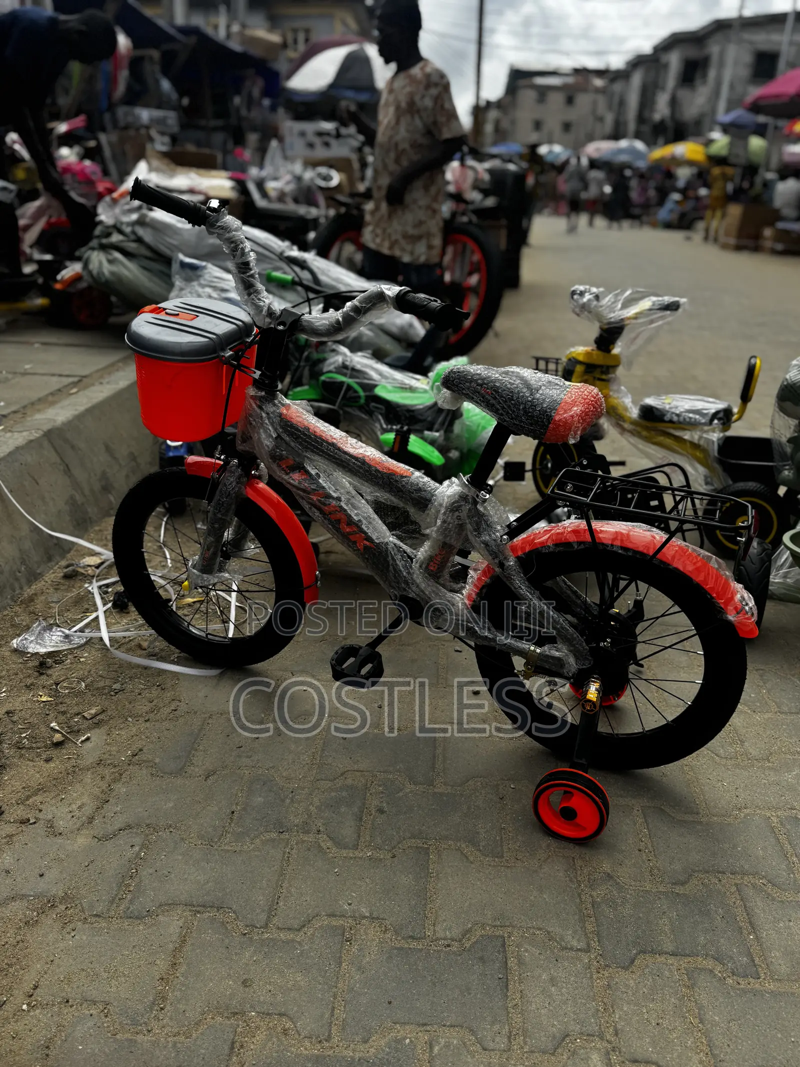 Kids Bicycle Featuring Training Wheels and a Front Storage Basket.