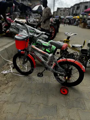Kids Bicycle Featuring Training Wheels and a Front Storage Basket.