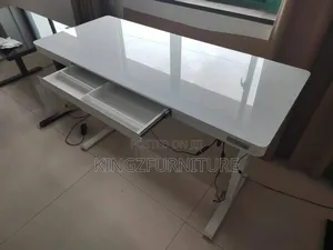 Electric Adjustable Table With a Glass Top,