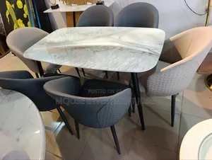 Glossy Marble Top Dining Table Set by 6 Chairs.