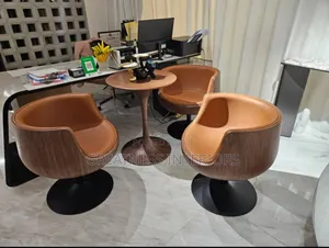 3 Premium Brown Swivel Lounge Chairs With Round Wooden Table