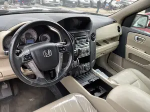 Honda Pilot Touring w/RES/Navi 4WD (3.5L 6cyl 5A) 2012 Maroon