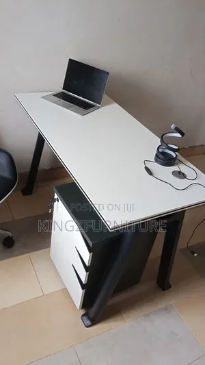 4-Foot Office Table With a White Top and Three-Drawer Storage Unit.
