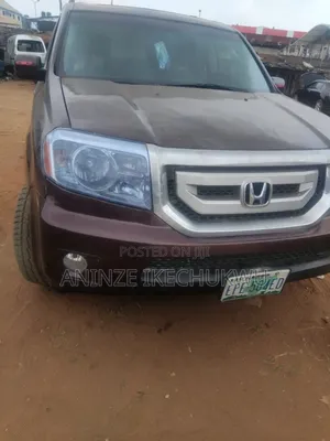 Honda Pilot Touring w/RES/Navi 4WD (3.5L 6cyl 5A) 2010 Burgundy