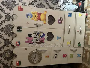 A Cream Color Baby Wardrobe