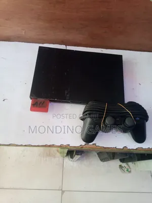 Sony Playstation 2 Slim Console With Two Pads and 15 Games Inside
