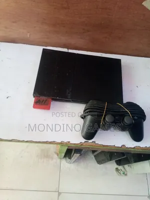 Sony Playstation 2 Slim With Two Pads and 15 Games Inside