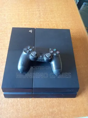 Sony Playstation 4 Fat Console With Two Pads and 10 Games Inside