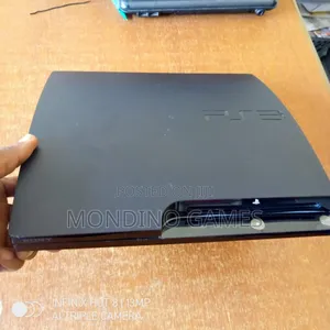 Sony Playstation 3 Slim Console With Two Pads and 10 Games Inside
