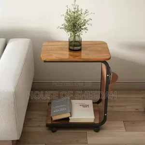 C-Shaped Side Table With Wheels and a Storage Compartment