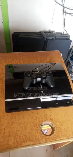 Sony Playstation 3 Console With Two Pads and 10 Games Inside