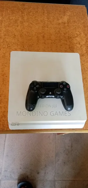 London Used Sony Ps4 Slim With Two Pads and 10 Games Inside