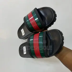 Gucci Men's Web Rubber Slide Sandal.