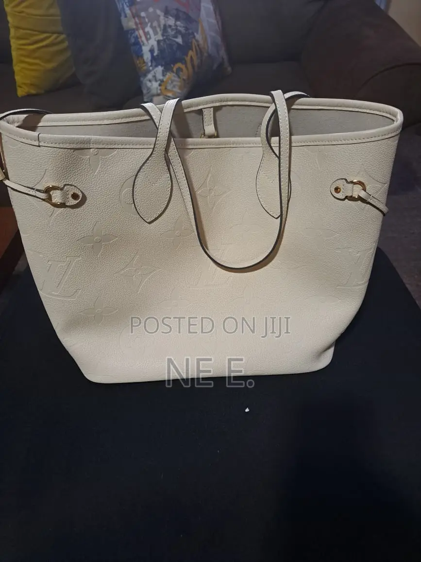 Lv Creme Empreinte Leather Neverfull Gm Bag