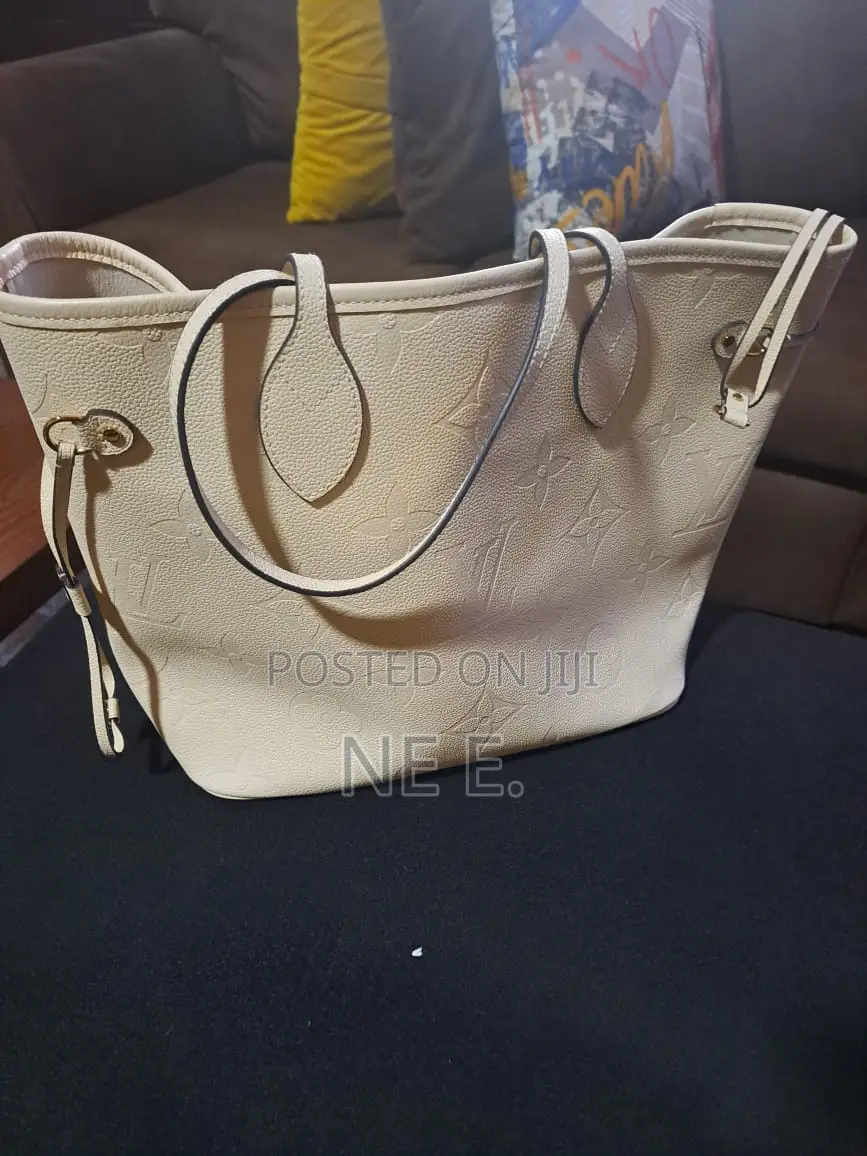 Lv Creme Empreinte Leather Neverfull Gm Bag