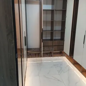Walk-in Closet With Dresser Mirror