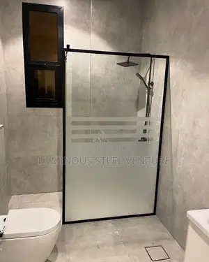 Frameless Glass Shower Enclosure With Stainless Steel Fittings 